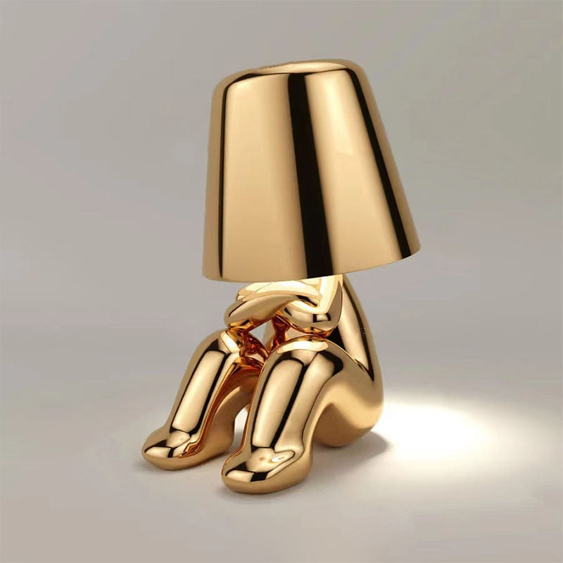 The Thinking Man's Little Golden Man Table Lamp: Lighting Up Creative Inspiration